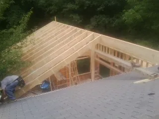 Framing a new roof addition that ties into an existing shingle roof in Raleigh